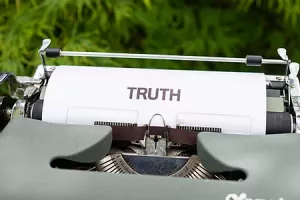 typewriter saying truth